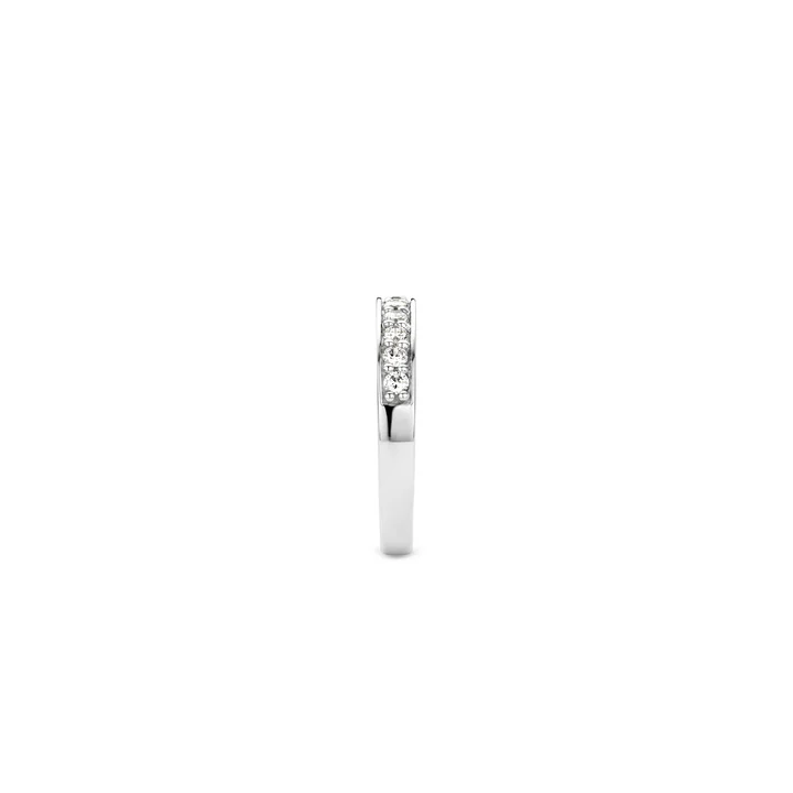This ring from the TI SENTO 1151ZI collection is delicately crafted out of smooth rhodium-plated sterling silver which forms a sharp aesthetic as a backdrop to the row of dazzling, cut crystals. These crystals have been cut into shape and set by hand. The craftsmanship which with the ring has been created means that it can be seamlessly connected to and combined with other rings. There's a whole range of rings to discover in the collection, most of which look great when worn in combination with each other. The in-house designers at TI SENTO conscientiously create these superb pieces according to their concept of Mix and Match.
