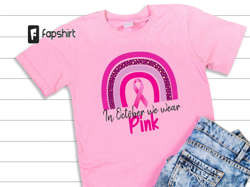 Breast cancer awareness month concept with pink rainbow pink ribbon and text in october we wear pink tshirt