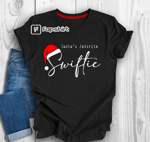 Santa’s Favorite Swiftie Shirt, Taylor Swift Christmas Shirt, Christmas Gift for Swifties, The Eras Tour Christmas Shirt