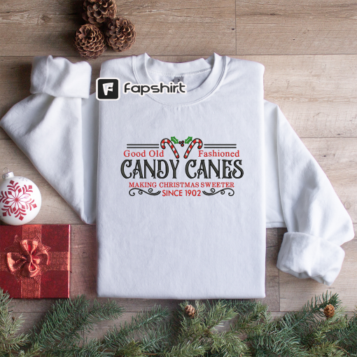 Embroidered Christmas Candy Canes Sweatshirt – Kringle Candy Company Embroidered Unisex Crewneck Sweatshirt or Hooded Sweatshirt.