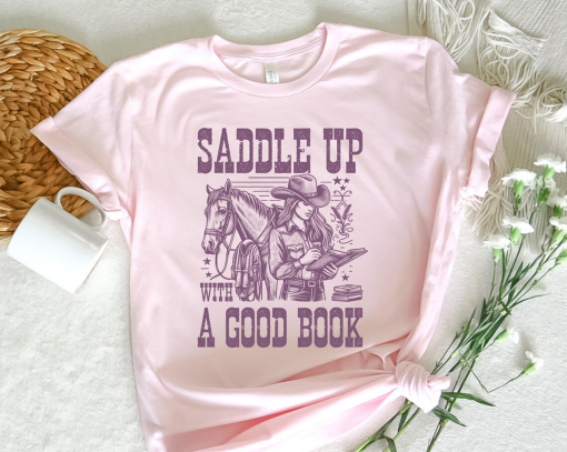 Saddle Up With A Good Book Cowgirl Shirt, Retro Western Book Lover Shirt , Vintage Style Graphic Shirt, Cowboy Romance Shirt Howdy Shirt