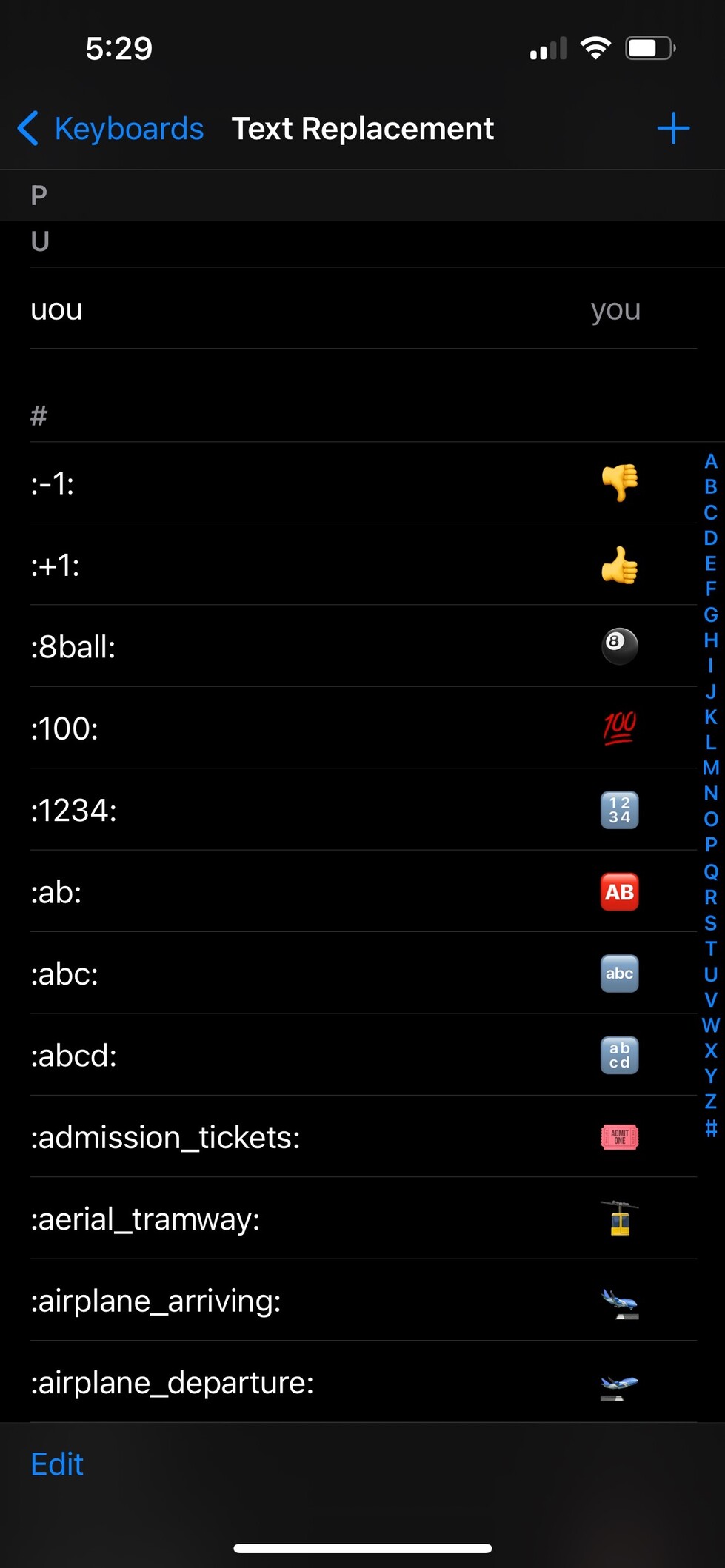 Screenshot of an iPhone's Text Replacement settings showing various text shortcuts and their corresponding emojis or text replacements.