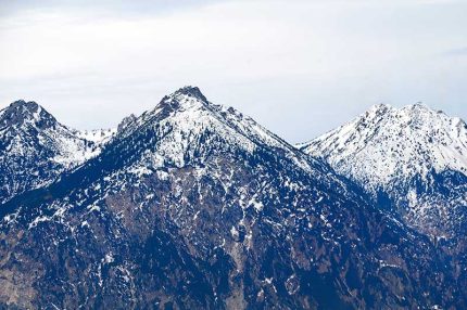 Majestic Snow-Capped Mountain Peaks Under Clear Winter Skies