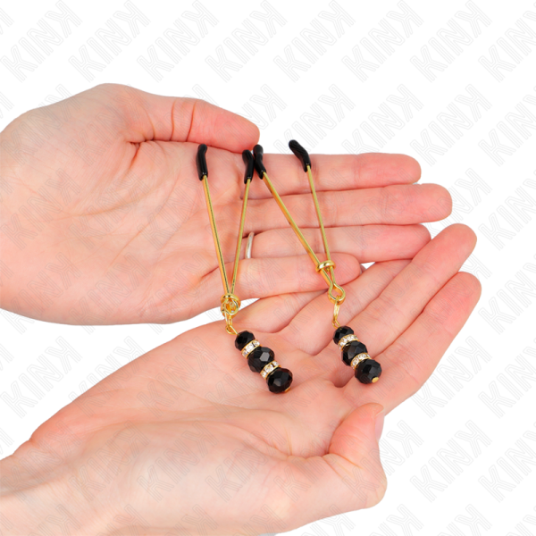 KINK - PINÃAS FINAS DOURADAS COM 3 CONTAS DE VIDRO PRETAS 7 CM - Imagen 3
